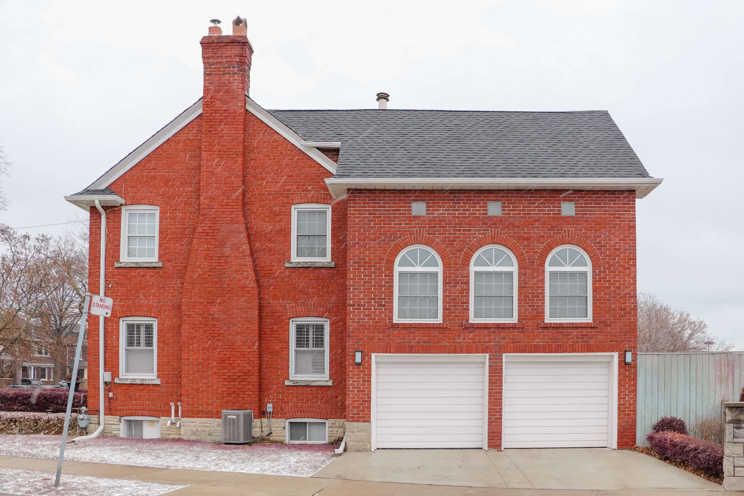 A two-story red brick house