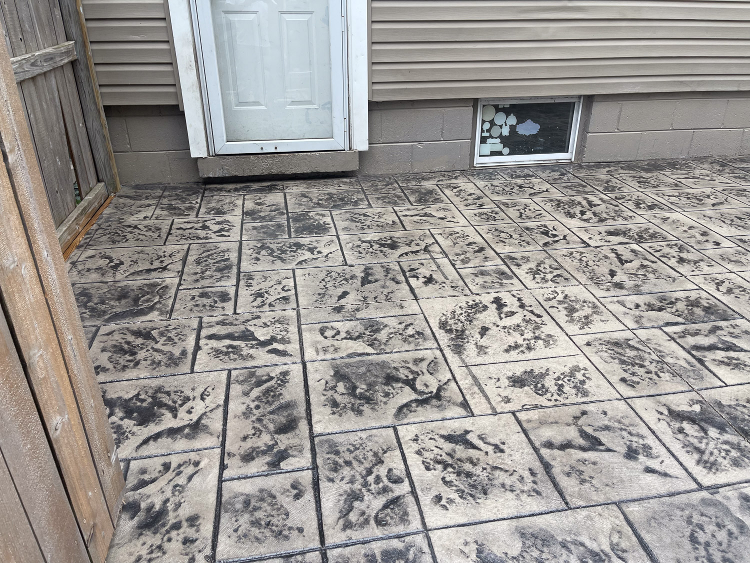 patio on back and side of house made of stamped comcrete